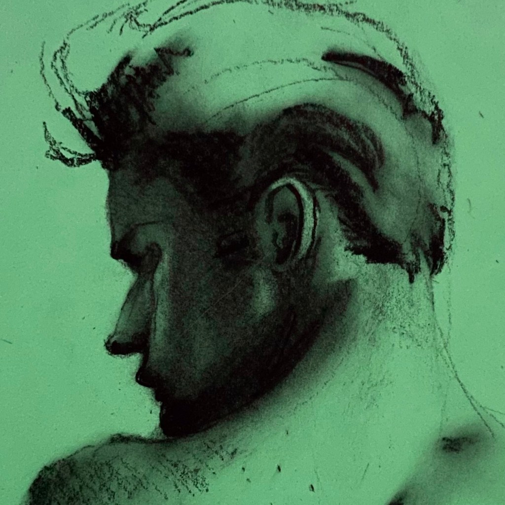 close up crop of a hand-drawn man's face in black charcoal